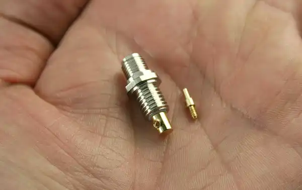 The R73648 is a female SMA antenna connector used for the chassis of the Midland G15 walkie talkie.